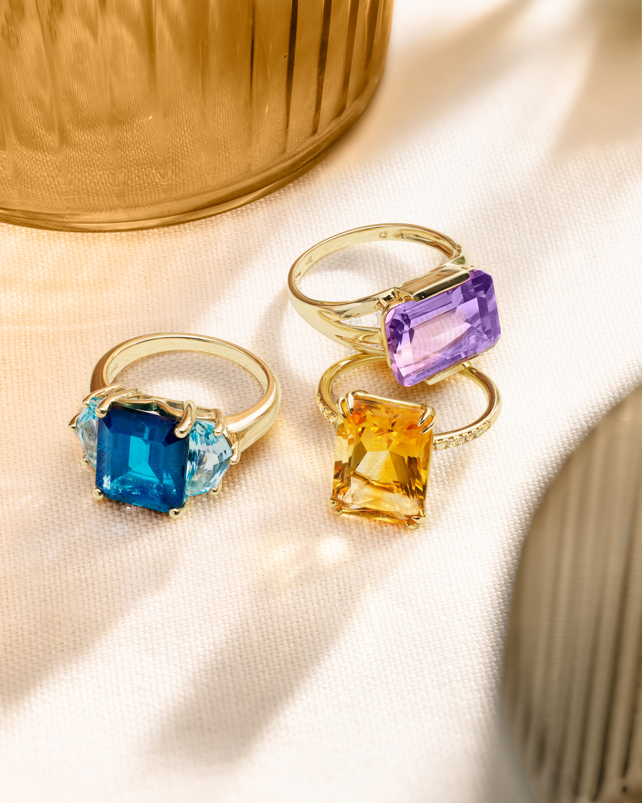 Three semi-precious rings.